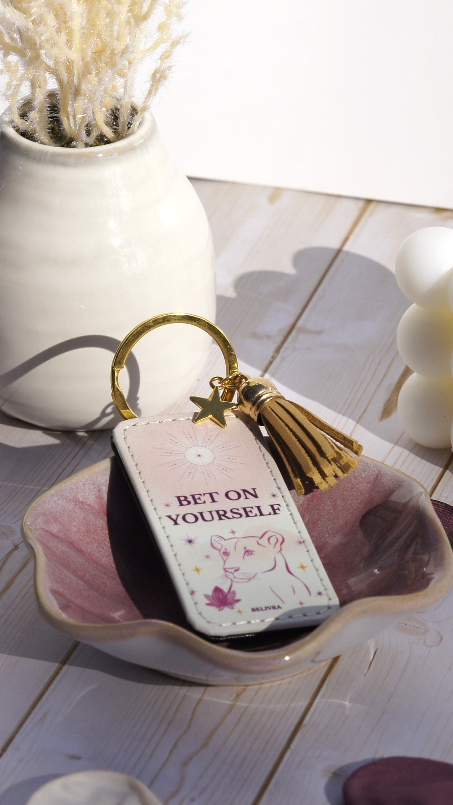 PU leather keychain with “Bet on Yourself” quote, gold star charm, and tassel, symbolizing courage and confidence by Belivra.