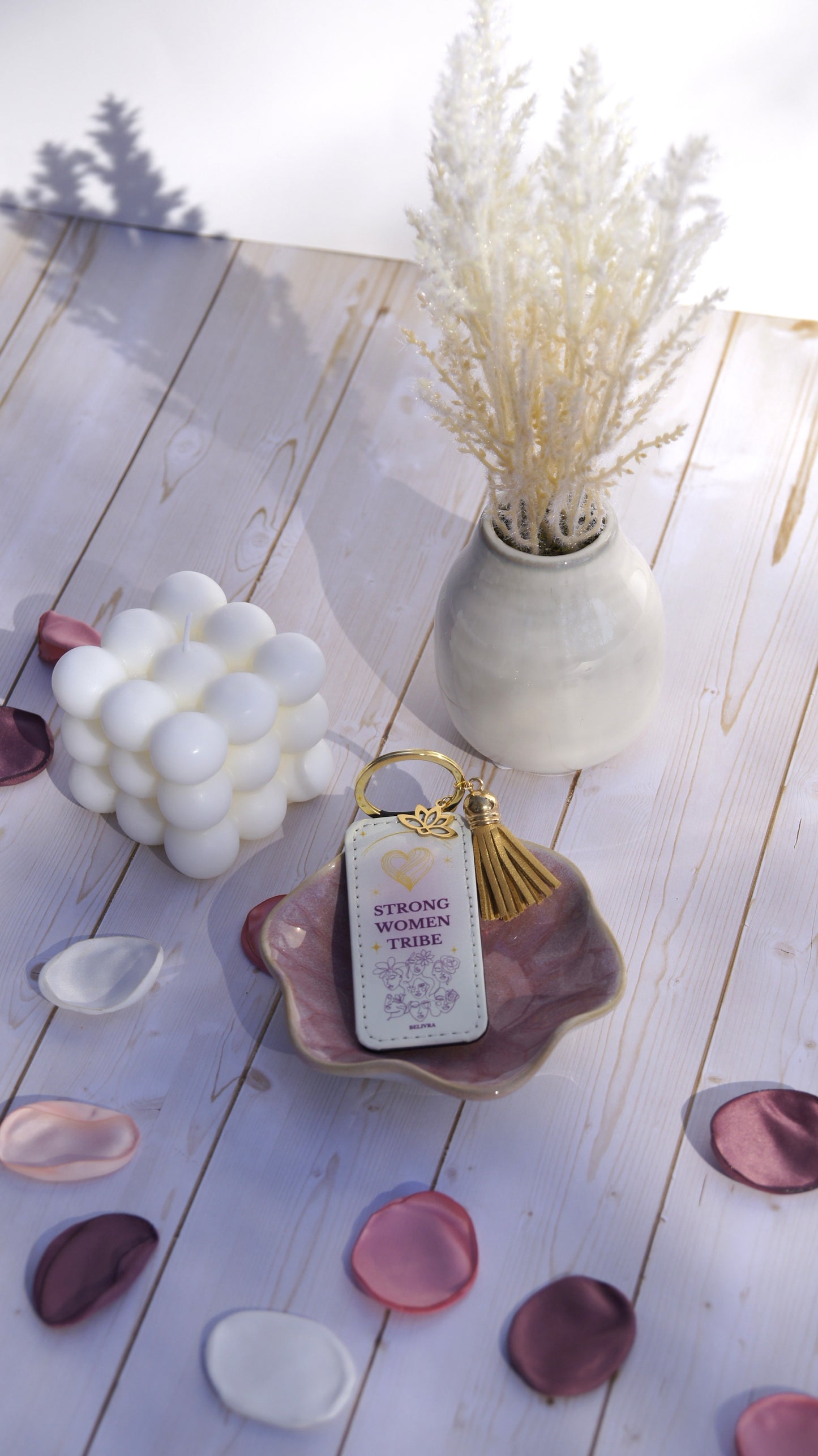 PU leather keychain with “Strong Women Tribe” quote, gold lotus charm, and tassel, celebrating sisterhood and strength by Belivra.