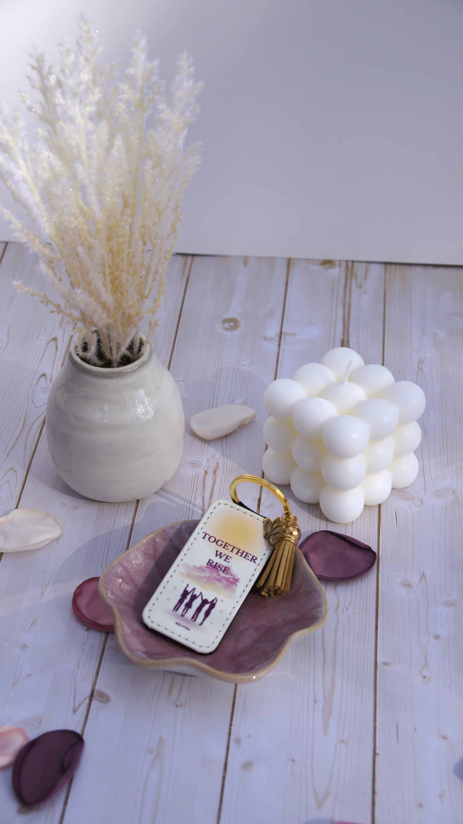 PU leather keychain with “Together We Rise” quote, gold lotus charm, and tassel, symbolizing sisterhood and empowerment by Belivra.