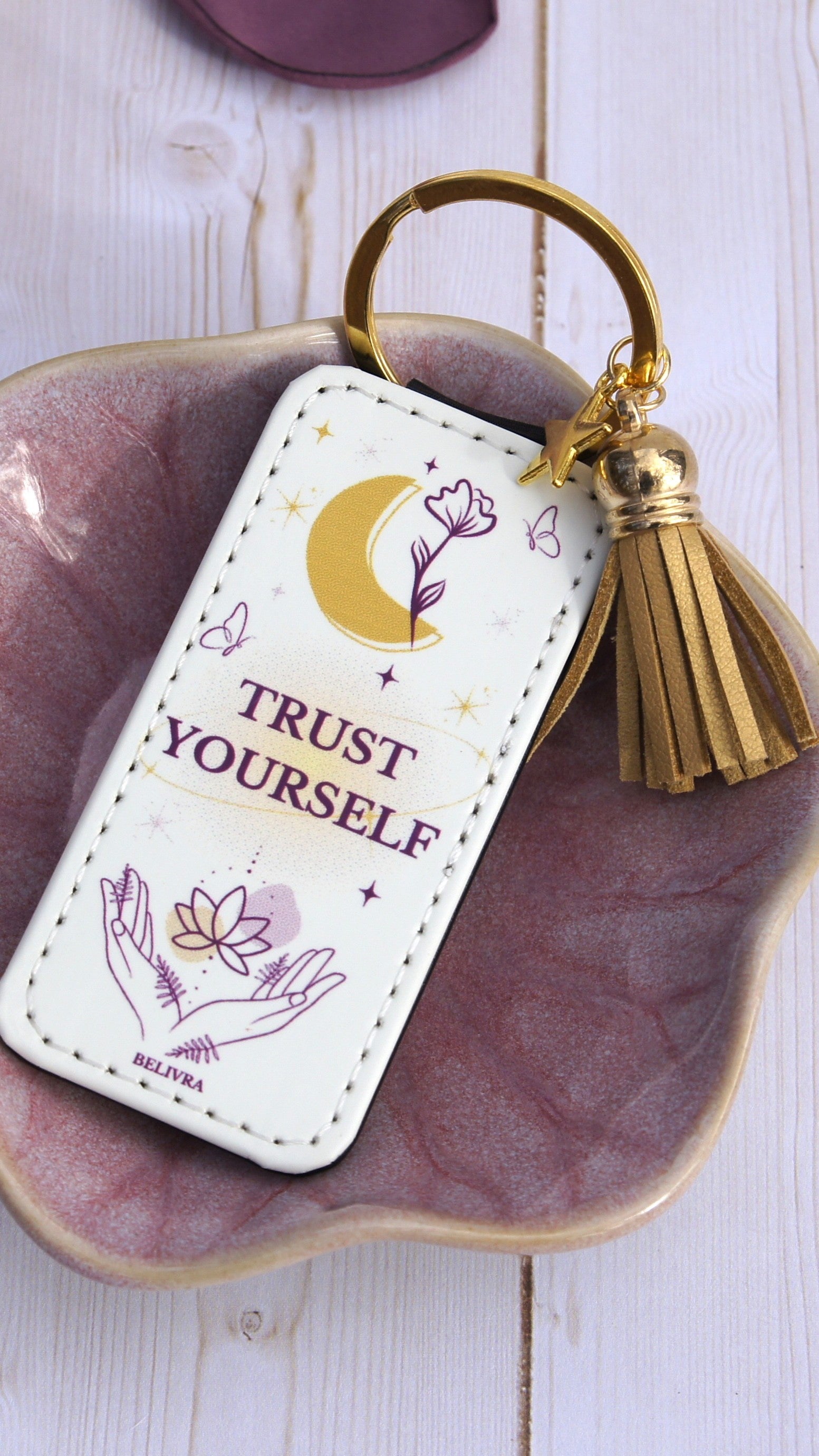 PU leather keychain with “Trust Yourself” quote, gold star charm, and tassel, symbolizing trust and confidence by Belivra.