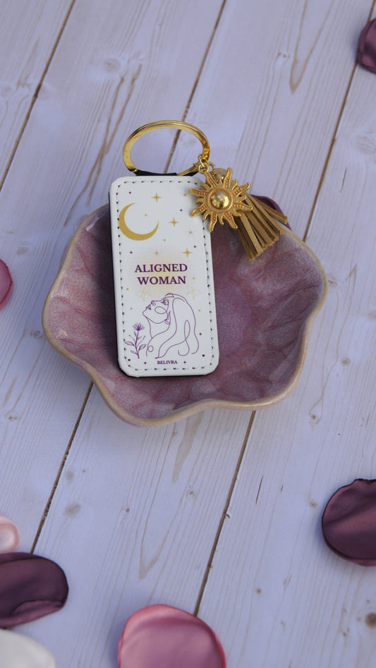 PU leather keychain with “Aligned Woman” quote, gold sun charm, and tassel, symbolizing mindfulness and balance by Belivra.
