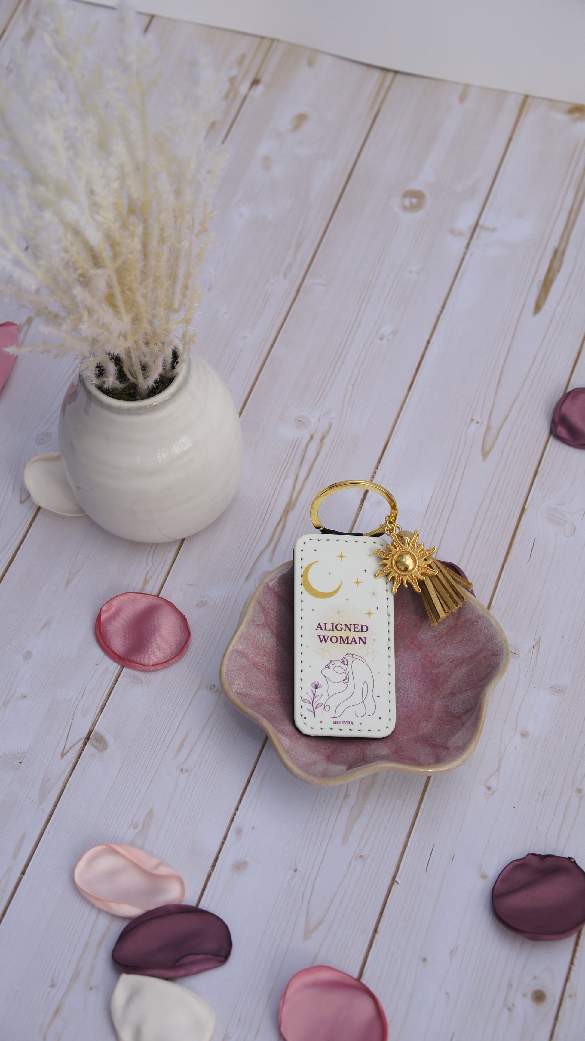 PU leather keychain with “Aligned Woman” quote, gold sun charm, and tassel, symbolizing mindfulness and balance by Belivra.