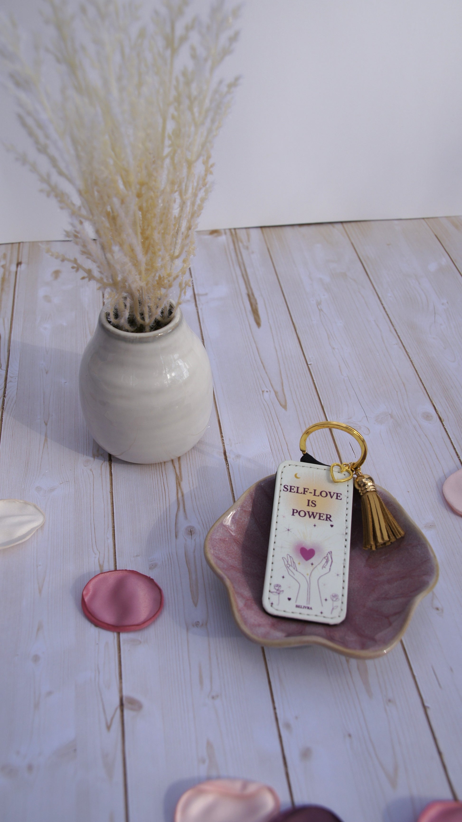 PU leather keychain with “Self-Love Is Power” quote, gold hollow heart charm, and tassel, symbolizing empowerment and confidence by Belivra.