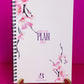 Spiral-bound notebook with a soft white cover featuring pink magnolia flowers and the inspirational phrase “DREAM PLAN DO” in elegant purple font. The notebook’s design combines motivational wording with a floral accent, offering a stylish and practical tool for planning, goal setting, and organization. Perfect for those who are ready to turn their dreams into action.