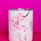 Close-up view of Belivra ceramic mug with delicate cherry blossom designs, showcasing the empowering phrase "Sip the Dream, Live the Vision." The mug features a spill-resistant lid, perfect for enjoying your favorite tea or coffee while embracing self-care and mindful moments. Ideal for sipping in style during morning routines or as an inspirational gift for women seeking daily motivation.