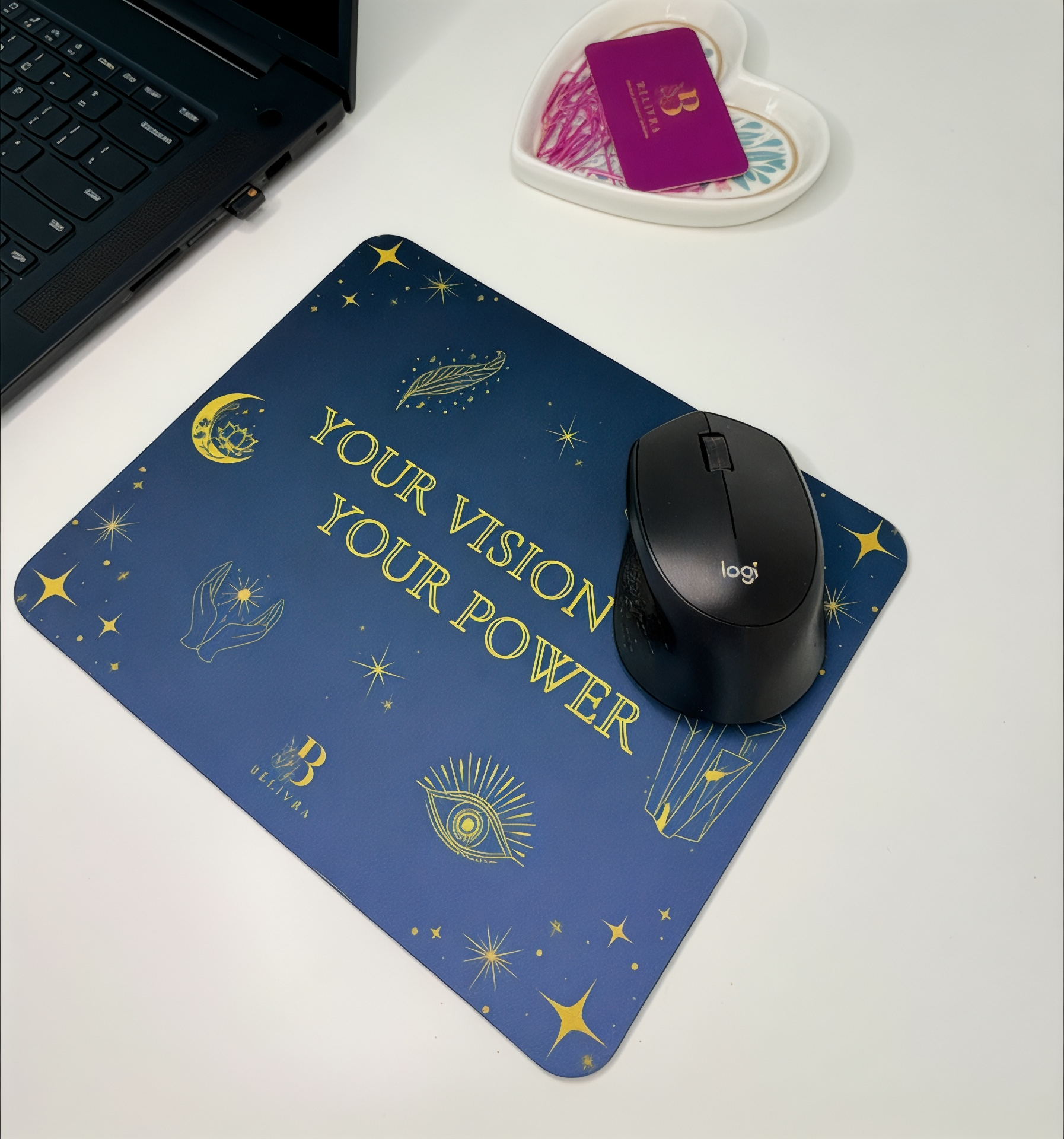 Belivra inspirational mouse pad with quote "Your Vision Your Power" in gold on a navy blue background – perfect motivational desk accessory for women entrepreneurs, work-from-home setups, or office decor. Shown with Logitech mouse, laptop, and heart-shaped organizer.