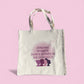 Cream polyester tote bag with “Strong Women Don’t Compete, We Connect” quote in purple tones, symbolizing women’s empowerment and unity by Belivra.
