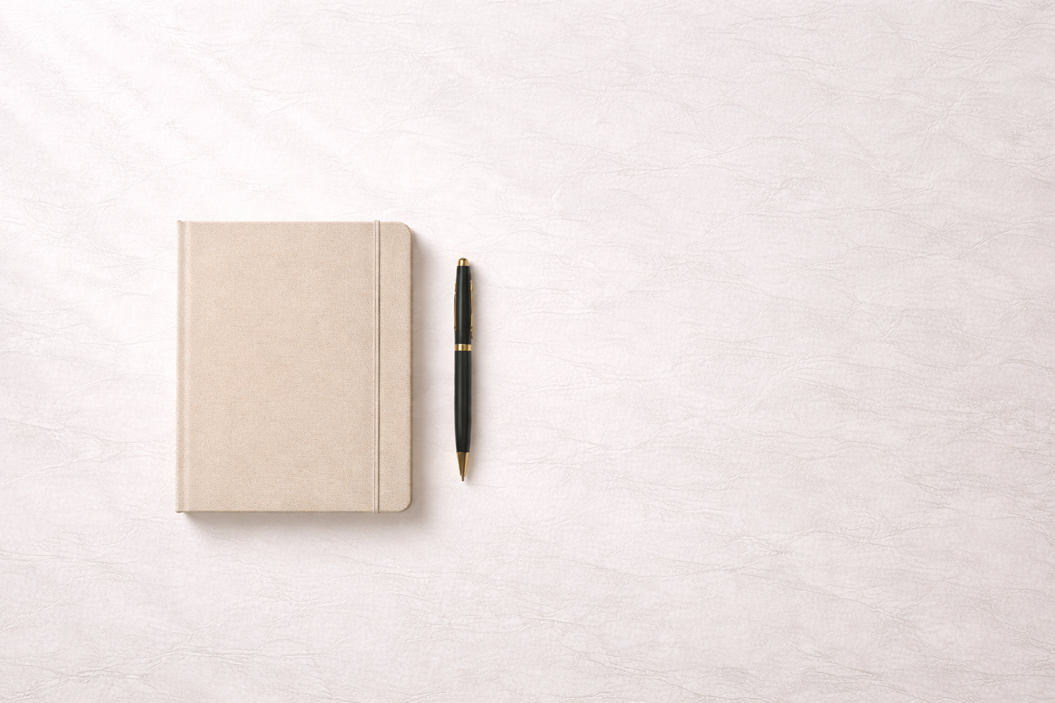 Minimal overhead workspace with notebook and pen representing structured clarity and deliberate decision making